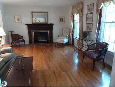 Living Room. FEATURES BEAUTIFUL HARDWOOD FLOORING 