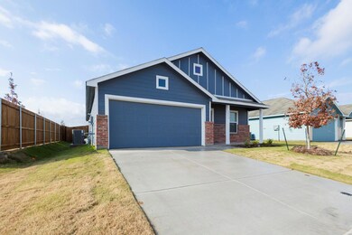 Craftsman inspired home featuring central AC unit,