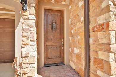 The front of the home has a  covered entrance .