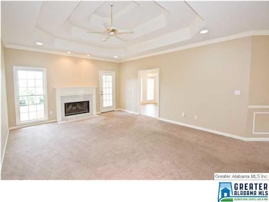 Huge living room with a triple-treyed ceiling.