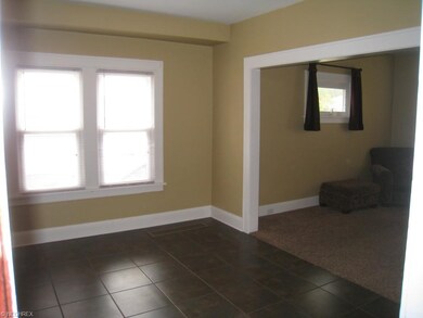 Dining room with beautiful ceramic floor open to t