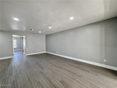 Unfurnished room featuring a textured ceiling, rec