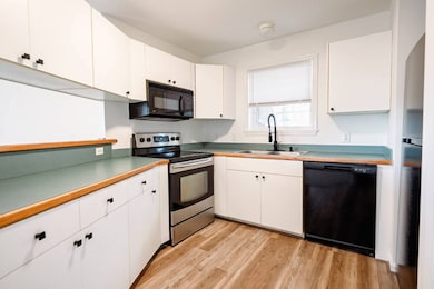 Kitchen has Laundry Closet & Shelves