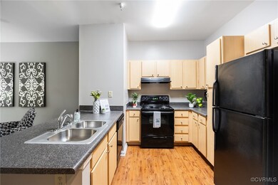 Kitchen featuring black appliances, under cabinet