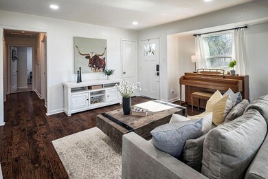 Living room includes a window alcove.