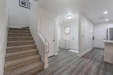 Foyer entrance featuring baseboards, wood finished