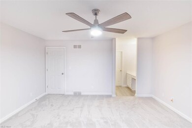 Owners suite and view into owners bath