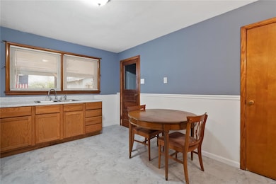 Large eat-in kitchen with full pantry and door to 