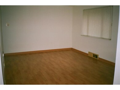 Living Room. LIVING ROOM SHOWING LAMINATE FLOORING