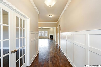 Walk in to a true foyer with 60 inch craftsman style wainscoting and entry to the oversized study.