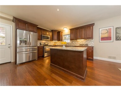 The warm bamboo floor and glass backsplash beautif