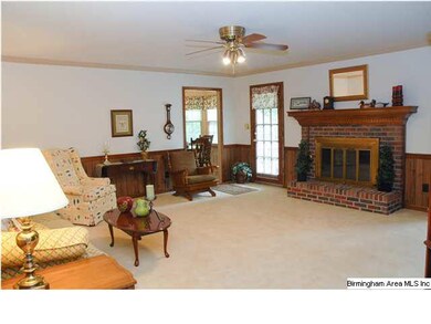 Living room with brick fireplace