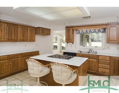 Kitchen. Cabinets galore! Kitchen flows to the sun
