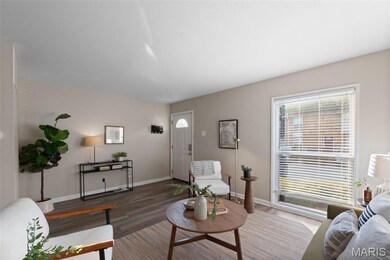 Living room featuring wood finished floors and healthy amount of natural light