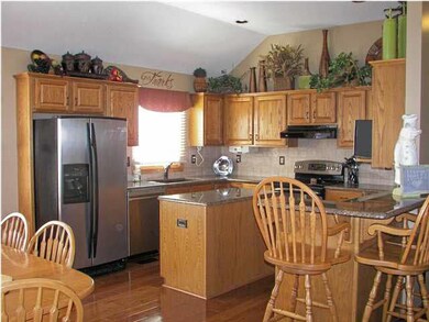The Kitchen is incredible with wood floors and gra