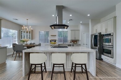 Custom white cabinets, double built in ovens, moen