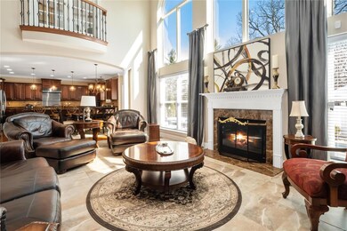 Two story great room with Romeo balcony adjoins the breakfast room and kitchen.