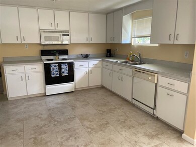 Spacious kitchen with an abundance of cabinetry.  