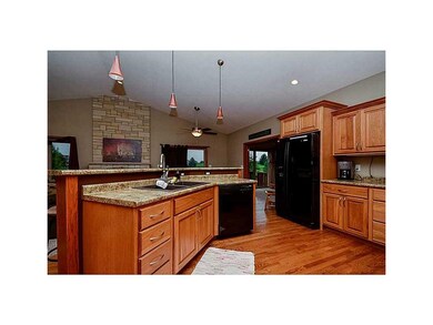 Kitchen. Gorgeous hickory wood flooring.