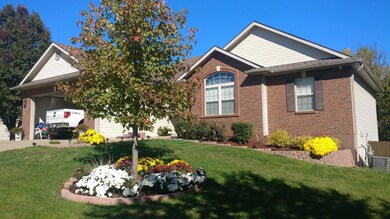 301 Joey Dr front of house with flowers,