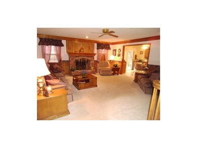 HUGE MAIN FLOOR FAMILY ROOM WITH RICH LIBRARY PANE