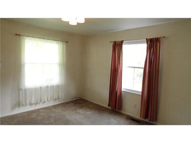 Living Room. Newer carpeting, pine wood underneath