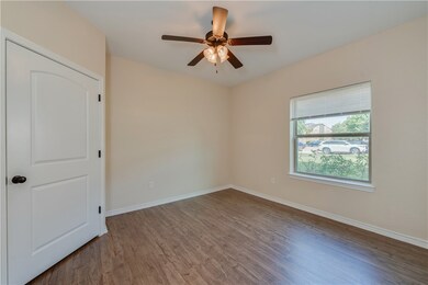Unfurnished room with baseboards, wood finished fl