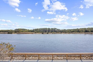 Property view of water with a view of trees