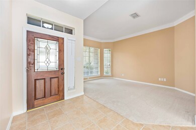 Beautiful wood door and tiled entry lead you to the formal sitting area. Can be used as office or flex space