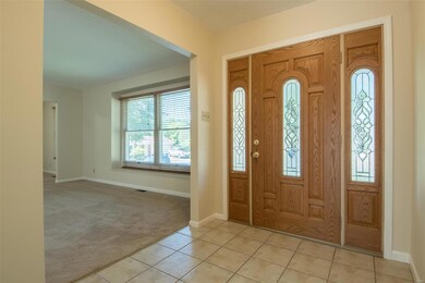 Entry foyer with access from front and from the ga