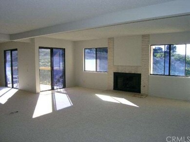 Living room is quite large and has a nice view