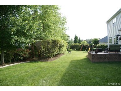 Rear yard showing raised patio