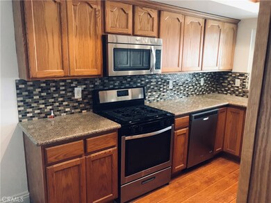 Newer oak cabinets and stainless steel appliances