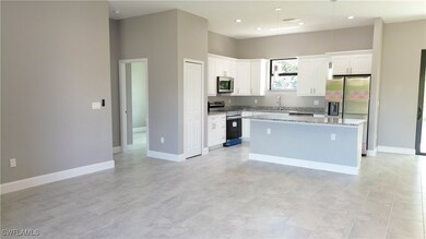 Kitchen featuring appliances with stainless steel