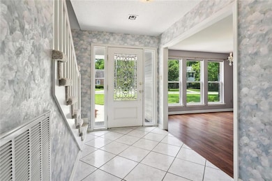 Walk into roomy foyer with tons of natural light f