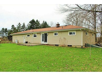 Exterior Back. French doors from the kitchen lead 
