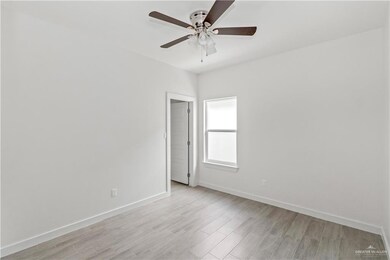 Spare room featuring light hardwood / wood-style flooring and ceiling fan
