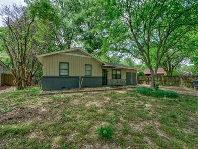 Ranch-style home featuring a front lawn