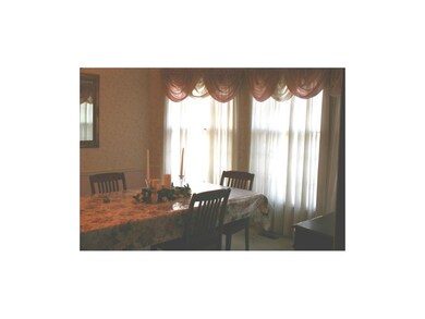 Formal dining room with lovely bay window.