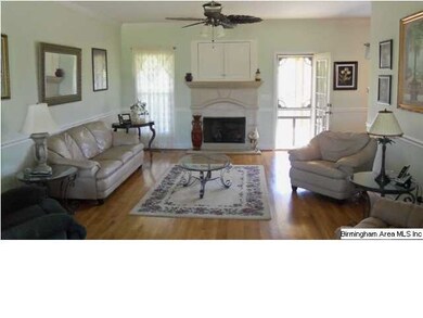 Living Room with hardwoods and gas log fireplace