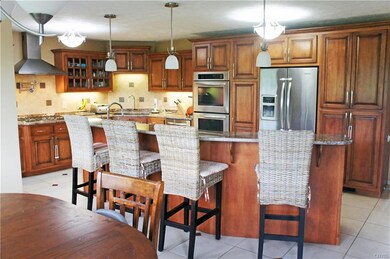 Huge eat in kitchen with custom cabinets.  Pull ou