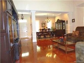 A VIEW FROM THE FAMILY ROOM INTO THE FORMAL DINING