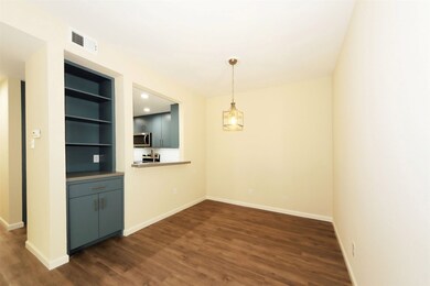 Dining room with custom built-in storage and pass-