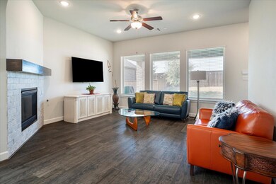 Living room with dark wood-type flooring, ceiling 