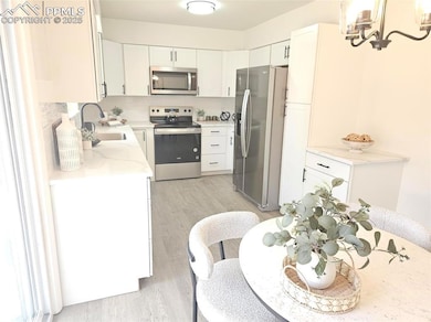 Kitchen featuring appliances with stainless steel 