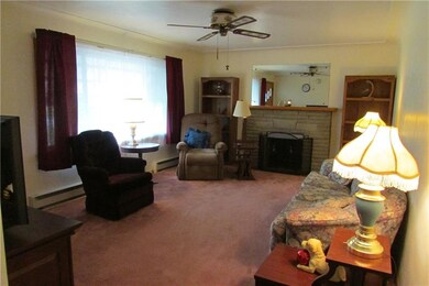 Spacious living room with wood burning fireplace a