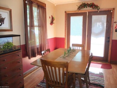 Dining room has crown molding and is open to the k