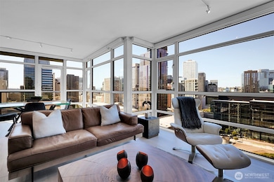 Enjoy HUGE cityscape, mountain, and Lake Union views from your livingroom.