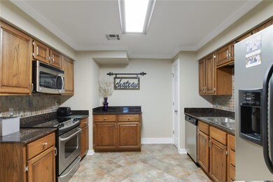 Very functional kitchen with granite counters and