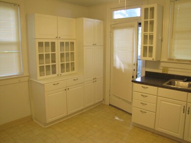 Kitchen with Door Leading to Back Deck